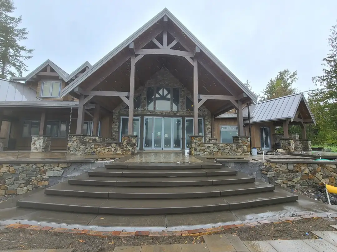 Front-facing perspective of the multi-tiered custom concrete steps and landing area in Puyallup, WA.