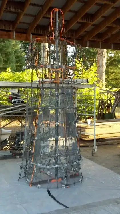 The steel rebar and mesh armature forming the base structure for a custom concrete sculpture in Puyallup.
