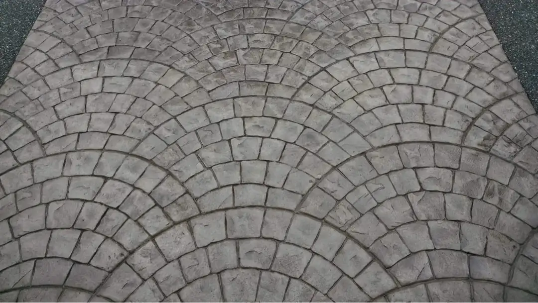A detailed close-up of the textured European fan stamp, showing the realistic stone shapes and grout lines.