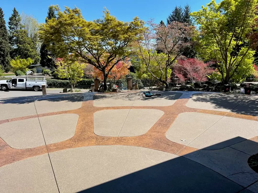 Wide view of the completed stamped concrete and sand finish driveway installation in Puyallup.