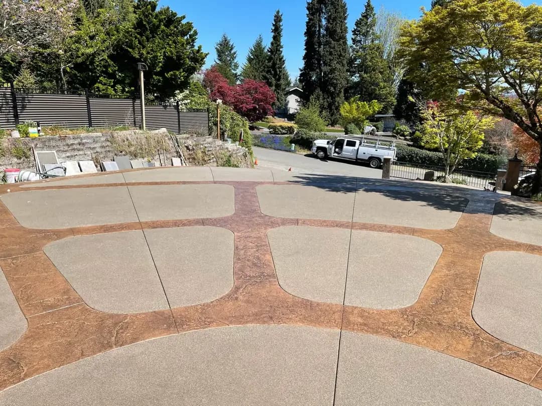 Elevated perspective of the driveway's flowing stamped pattern and saw-cut control joints.