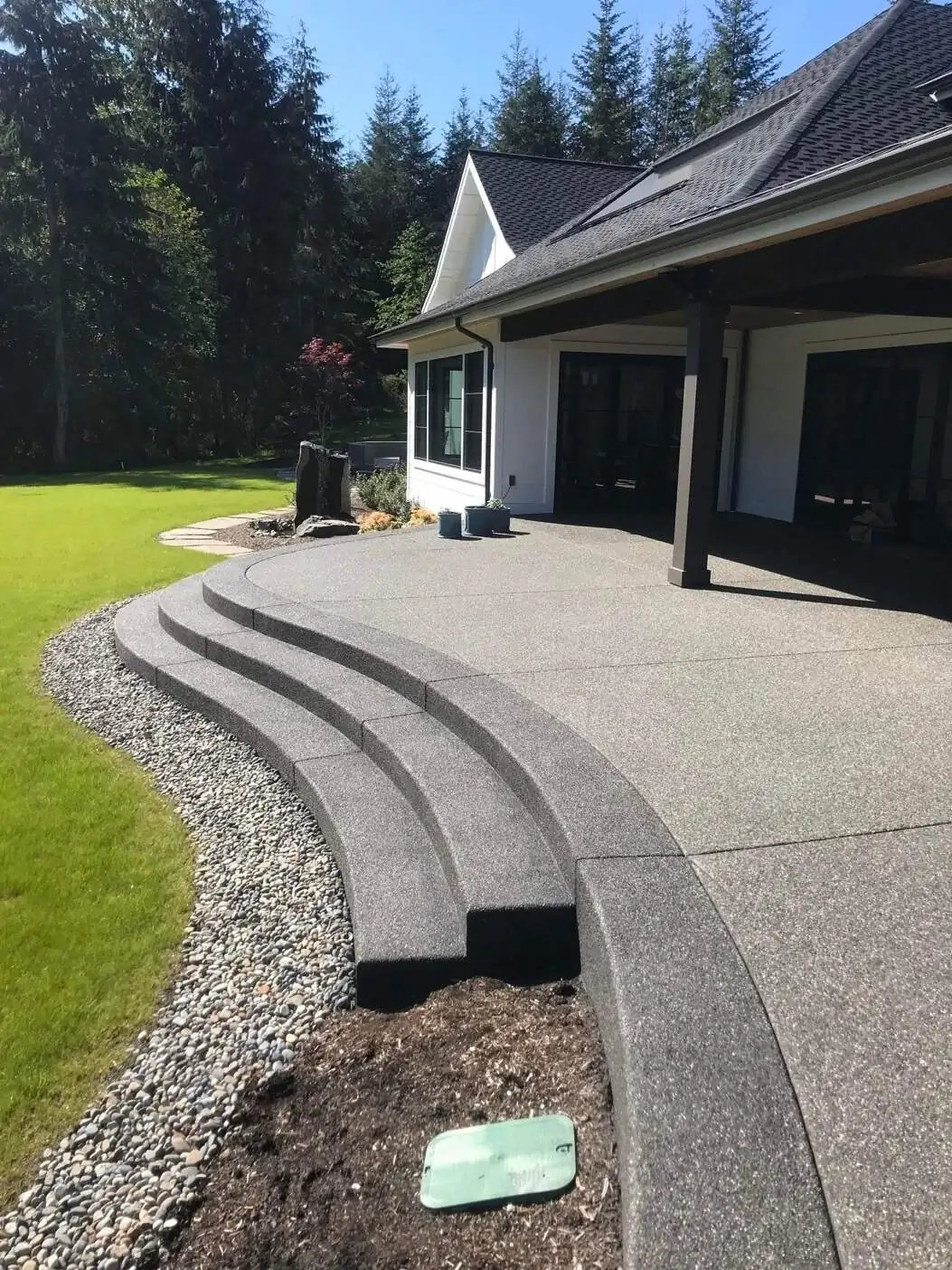 Another angle of the tiered, curved exposed aggregate steps, showing the precision of the formwork.
